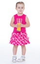 Little girl with a glass of orange juice. Royalty Free Stock Photo