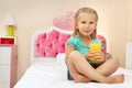 Little girl with glass of orange juice Royalty Free Stock Photo
