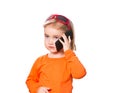 Little girl in glasses talking on smartphone . Royalty Free Stock Photo