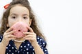 Little girl going to eat a donut. Royalty Free Stock Photo