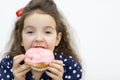 Little girl going to eat a donut. Royalty Free Stock Photo