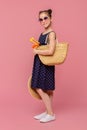 Little girl going to swim with diving mask in wicker bag Royalty Free Stock Photo