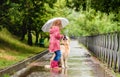 Little girl with dog under rain Royalty Free Stock Photo