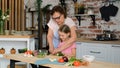 Little Girl with Granny Preparing Vegetable Salad Royalty Free Stock Photo