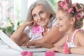 Little girl with granny using laptop Royalty Free Stock Photo