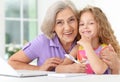 Little girl with granny using laptop Royalty Free Stock Photo