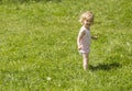 Little girl in the grass Royalty Free Stock Photo