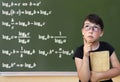 Little girl and green blackboard. Wunderkind