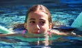 Little girl green eyes children playing at pool at tropical resort in Los Cabos Mexico Royalty Free Stock Photo