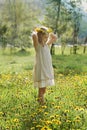 Little girl on green grass and summer flowers outdoors Royalty Free Stock Photo