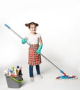 Little girl in green rubber gloves ready for cleaning. She holds a mop in her hands Royalty Free Stock Photo