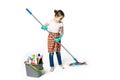 Little girl in green rubber gloves ready for cleaning. She holds a mop in her hands Royalty Free Stock Photo