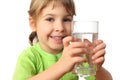 Little girl in green shirt holding glass