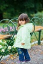 Little girl in green walking park. Royalty Free Stock Photo