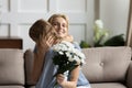 Little girl greeting excited mom with birthday Royalty Free Stock Photo