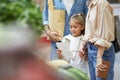 Little Girl Grocery Shopping with Family Royalty Free Stock Photo