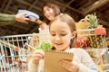 Little Girl Grocery Shopping in Supermarket Royalty Free Stock Photo