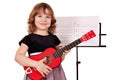 Little girl with guitar posing