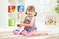 Little girl with guitar toy gift Royalty Free Stock Photo