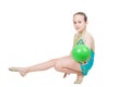 Little girl gymnast with green ball Royalty Free Stock Photo