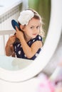 Little girl is hairbrushing