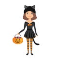 Little girl in halloween black cat costume isolated on white background. Child holds pumpkin basket with sweets. Royalty Free Stock Photo