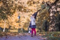 Little girl in Halloween forest. Child playing in autumn park. Kids pick ripe vegetables on a farm in Thanksgiving Royalty Free Stock Photo