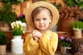 Little girl hand praying, hands folded in prayer concept for faith, spirituality and religion. Happy little blond girl in a yellow Royalty Free Stock Photo