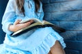 Little girl hands folded in prayer on a Holy Bible in church for faith concept in vintage color tone Royalty Free Stock Photo