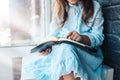 Little girl hands folded in prayer on a Holy Bible in church for faith concept in vintage color tone Royalty Free Stock Photo