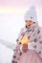 Little girl hands holding string of bokeh lights. Christmas decoration to make wish Royalty Free Stock Photo