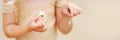 Little girl hands puling petals from a chamomile. Soft focus Royalty Free Stock Photo