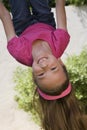 Little Girl Hanging Upside Down