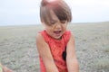 Little girl happy smiling in big landscape environment. Child emotionally with expression playing