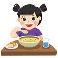 A Little girl happy to eat Soup