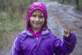 Little girl harvest mushrooms in woods. Child with fresh mushroom in autumn forest. Organic and healthy food. Upbringing Royalty Free Stock Photo