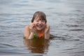 A little girl has fun playing in the river diving and splashing Royalty Free Stock Photo