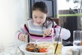 Little girl having a big breakfast Royalty Free Stock Photo