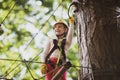 Little girl having fun at adventure park. Artworks depict games at eco resort which includes flying fox or spider net