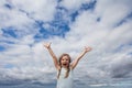 Little girl having fun against sky clouds outdoors Royalty Free Stock Photo