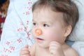 Little girl having fun with elastic band on nouse Royalty Free Stock Photo