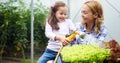 Little girl having fun in the garden, planting, gardening, helping her mother Royalty Free Stock Photo