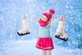 Little girl having fun at ice skating in winter Royalty Free Stock Photo