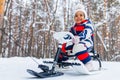 little girl having fun and sledding sled playing in snowy park