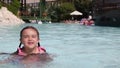 Little girl having fun in a swimming pool