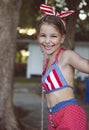Little girl having fun on tire swing on summer day Royalty Free Stock Photo
