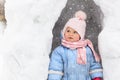 Little girl having fun in winter snow cave Royalty Free Stock Photo