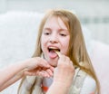 Little girl having his throat examined by health professional Royalty Free Stock Photo