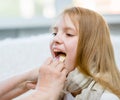 Little girl having his throat examined by health professional Royalty Free Stock Photo