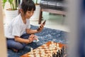 Little girl having online chess lesson, e-education, distance learning